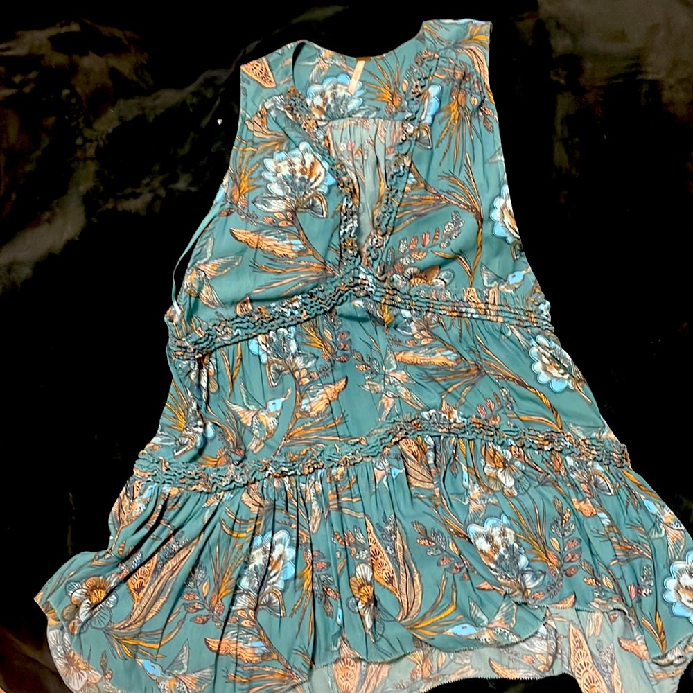 One of a kind free people could be use as a dress or a long shirt